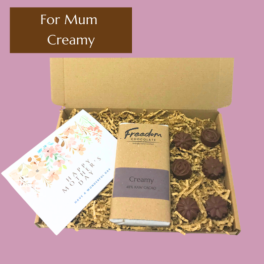 Mother’s Day chocolate gift featuring Creamy artisan chocolate bar and solid chocolate flowers with handwritten card.