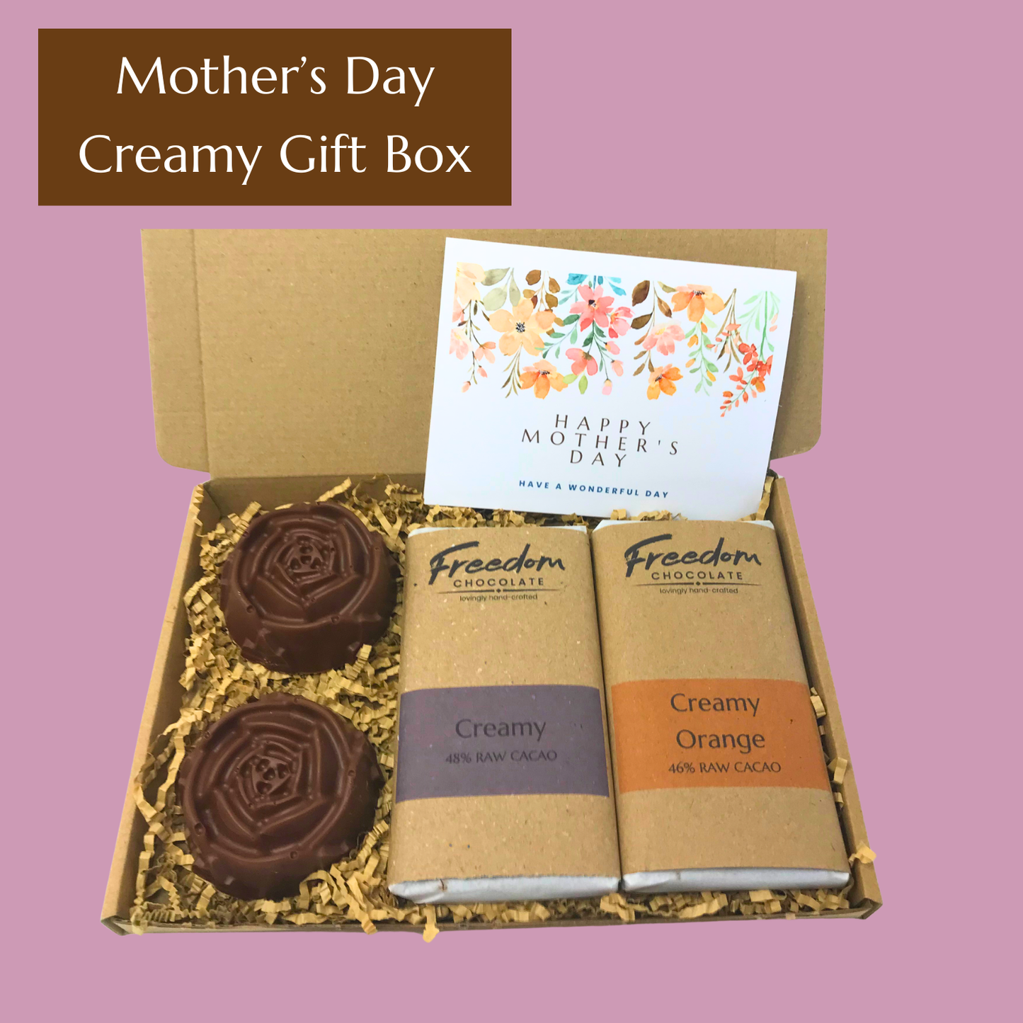 Mother’s Day gift box featuring Creamy and Creamy Orange chocolate bars, two large solid chocolate flowers and handwritten card.