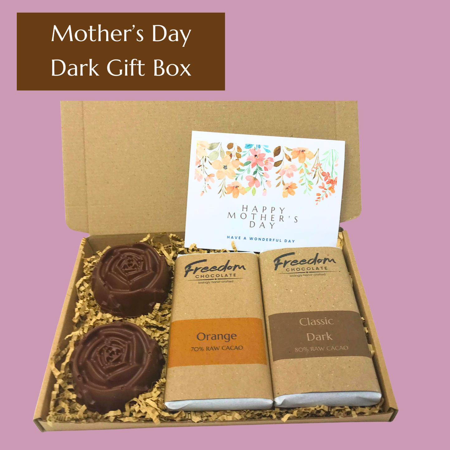 Mother’s Day gift box featuring Classic Dark and Dark Orange chocolate bars, two large solid chocolate flowers and handwritten card